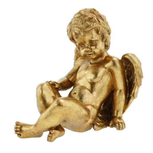 Gold statue of a cherub on a white background