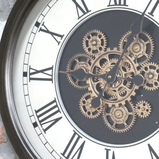 Close-up of a clock with visible gears and Roman numerals