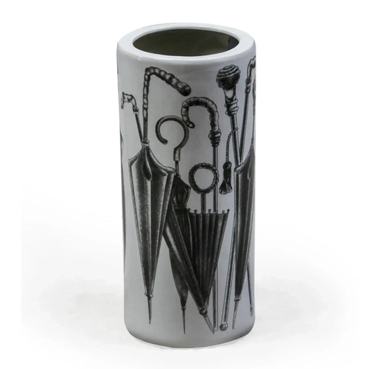 Cylindrical vase with black umbrella and cane design on a white background