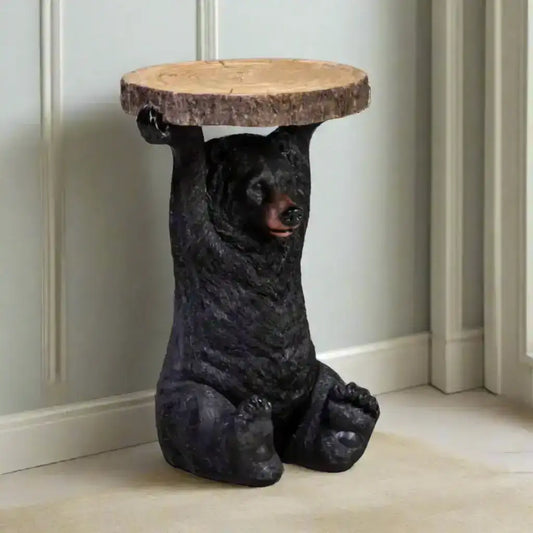Bear-shaped side table with wooden top on a neutral background