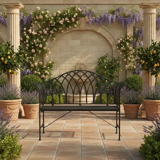 Decorative outdoor setting with a black metal bench, stone archway, and potted plants.