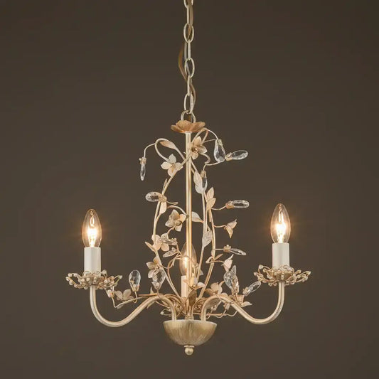 Decorative chandelier with two lit lights on a dark background
