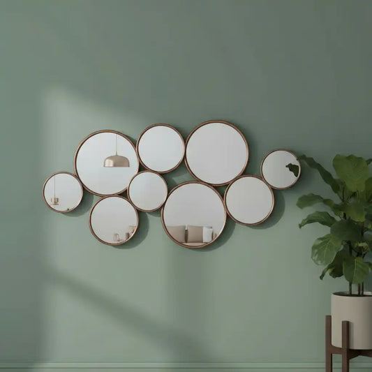 Wall with circular mirrors and a plant on a green wall