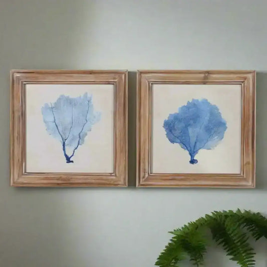 Two framed artworks of blue coral on a white background