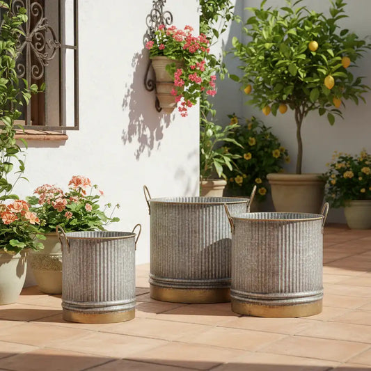 Decorative metal planters on a patio with various plants and flowers.