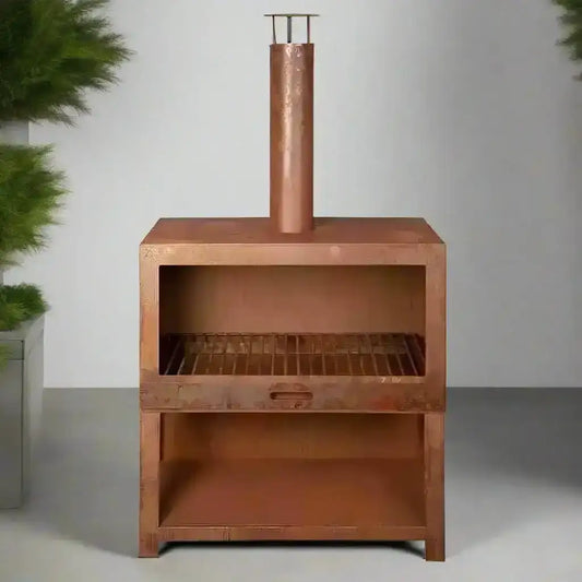 Copper barbecue grill on a gray background with green plants.