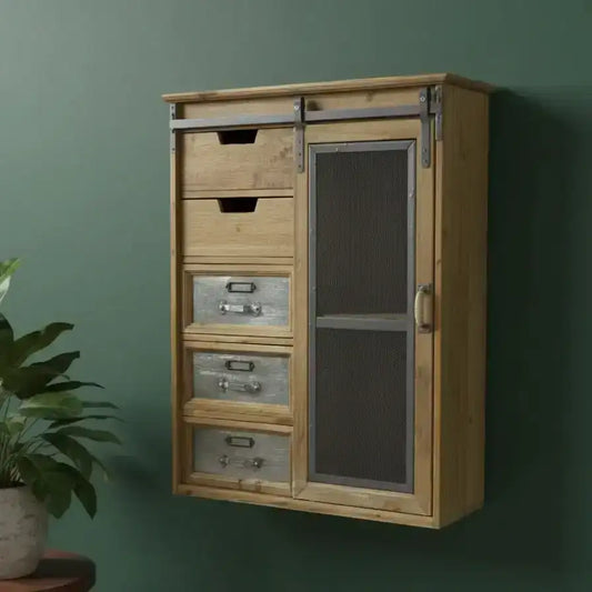 Wooden cabinet with glass door and drawers against a green wall with a plant on a small table.