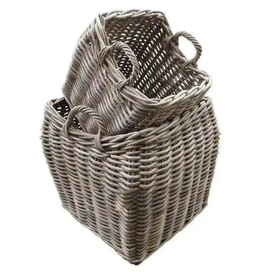 Two woven baskets with handles on a white background