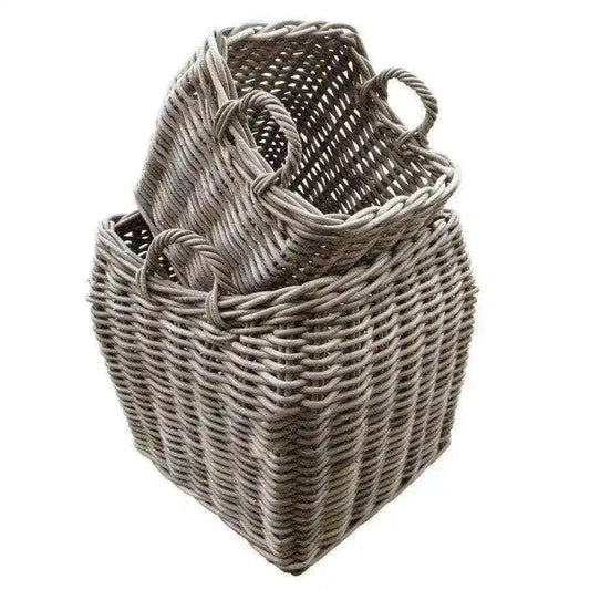 Two woven baskets with handles on a white background