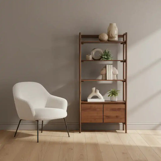 White chair and wooden bookshelf with decorative items in a minimalistic room.