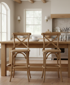 Wooden dining table with two chairs in a kitchen setting
