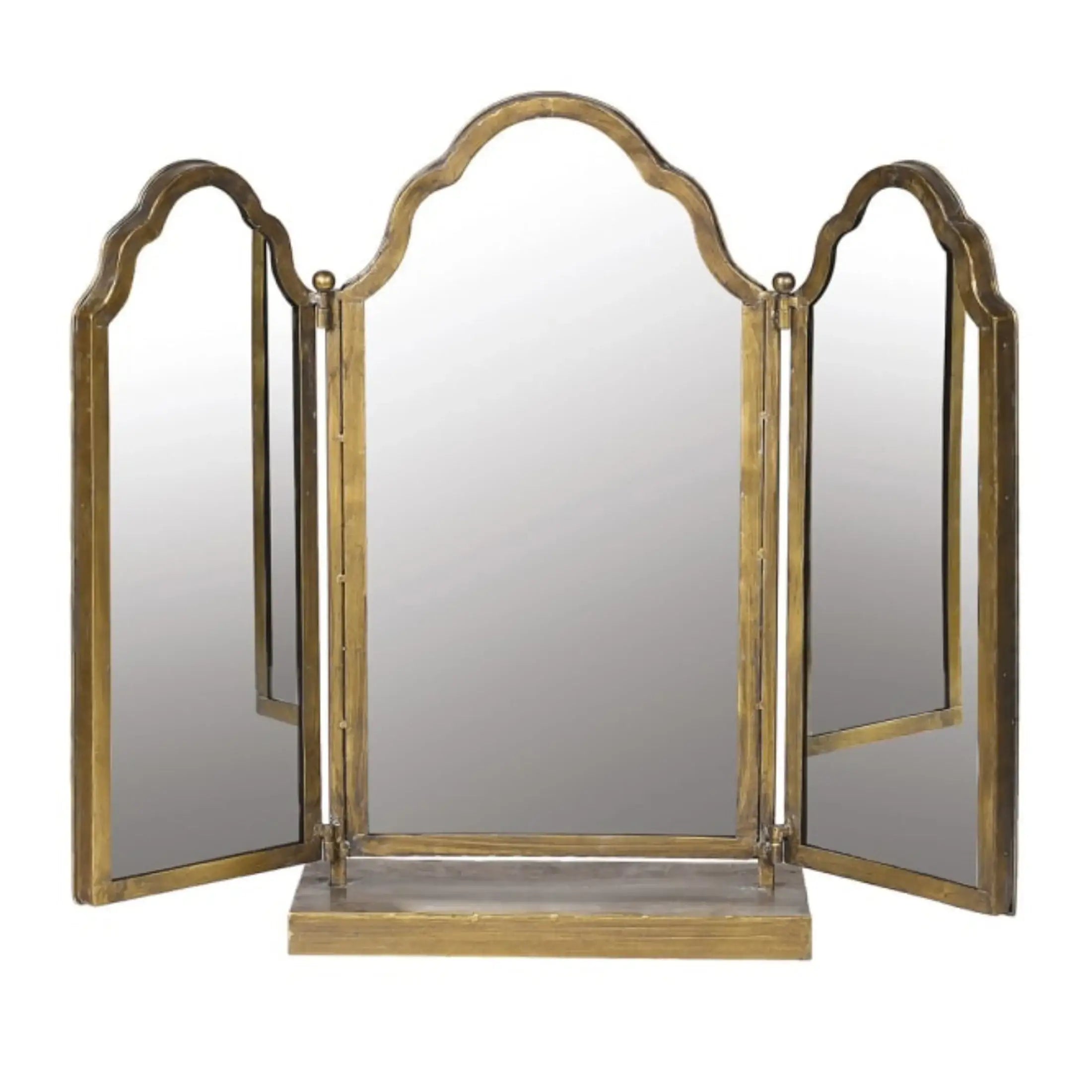 Tri-fold vanity mirror with gold frame on a white background