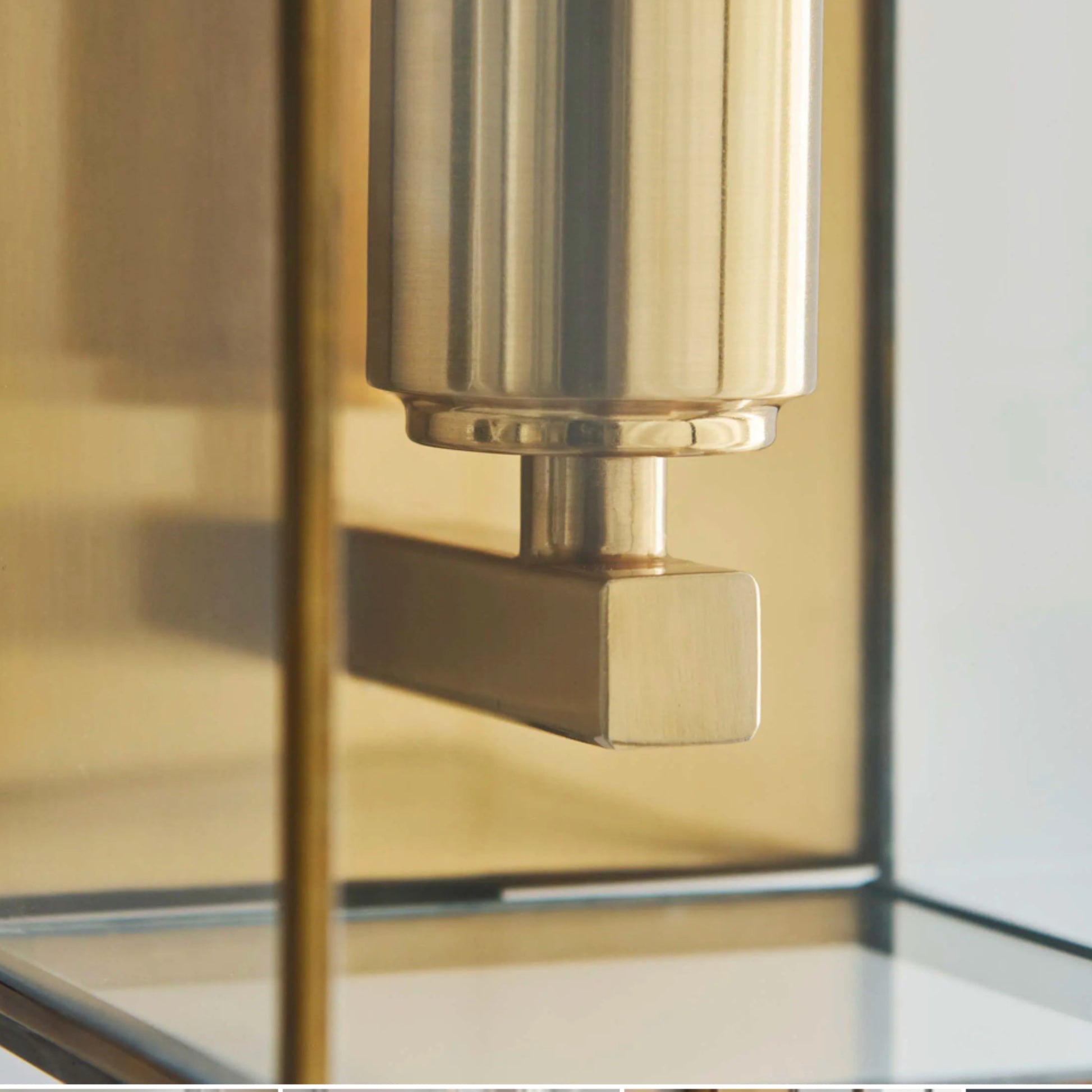 Gold door handle on a glass door
