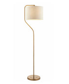 Floor lamp with gold base and white shade on a white background