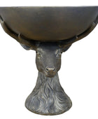 Bronze deer head sculpture with bowl on a wooden surface