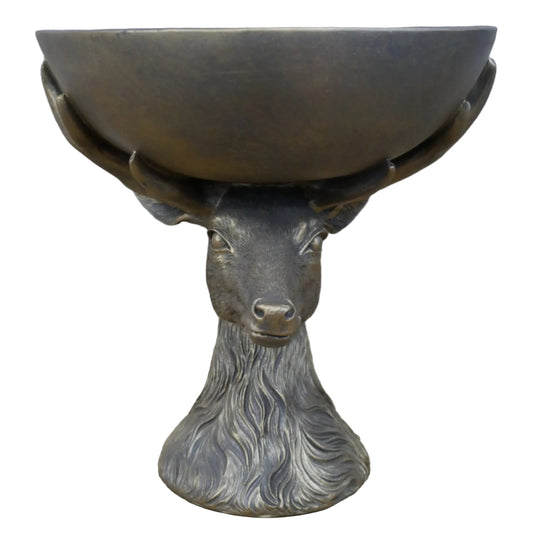 Bronze deer head sculpture with bowl on a wooden surface