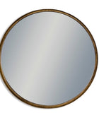 Round mirror with a gold frame on a white background