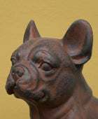 Bronze statue of a dog on a gold background