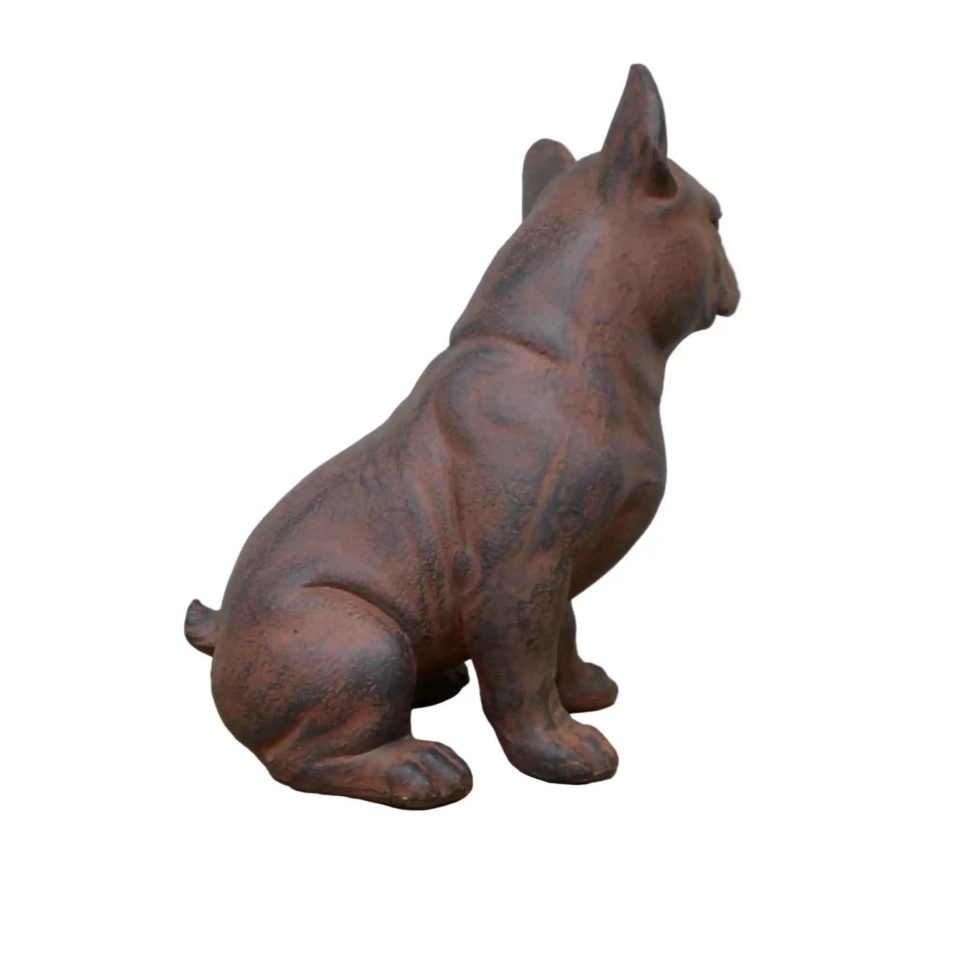 Cast iron dog statue on a wooden surface with a white background