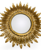 Gold sunburst mirror on a white background