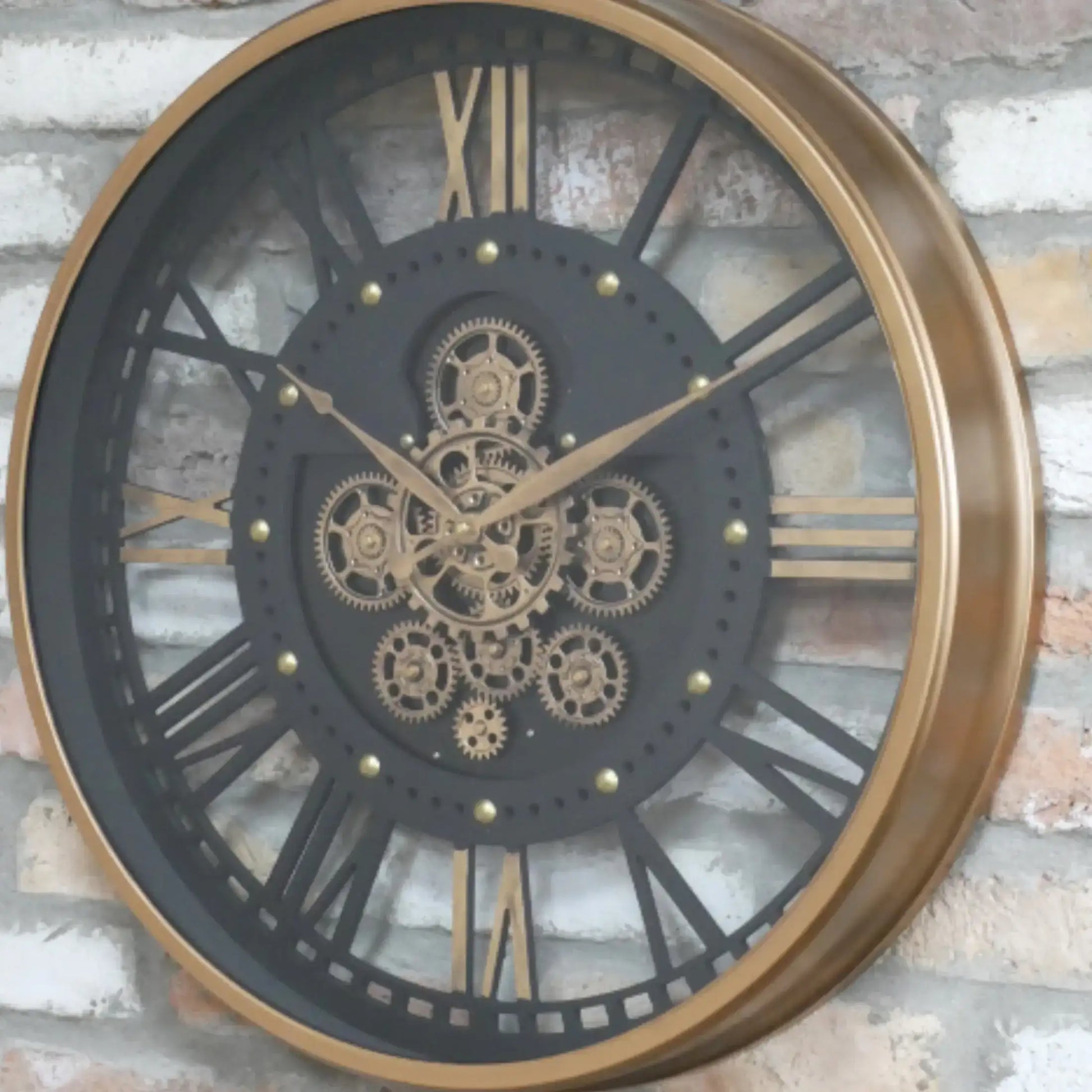 Decorative wall clock with gear design on a brick wall