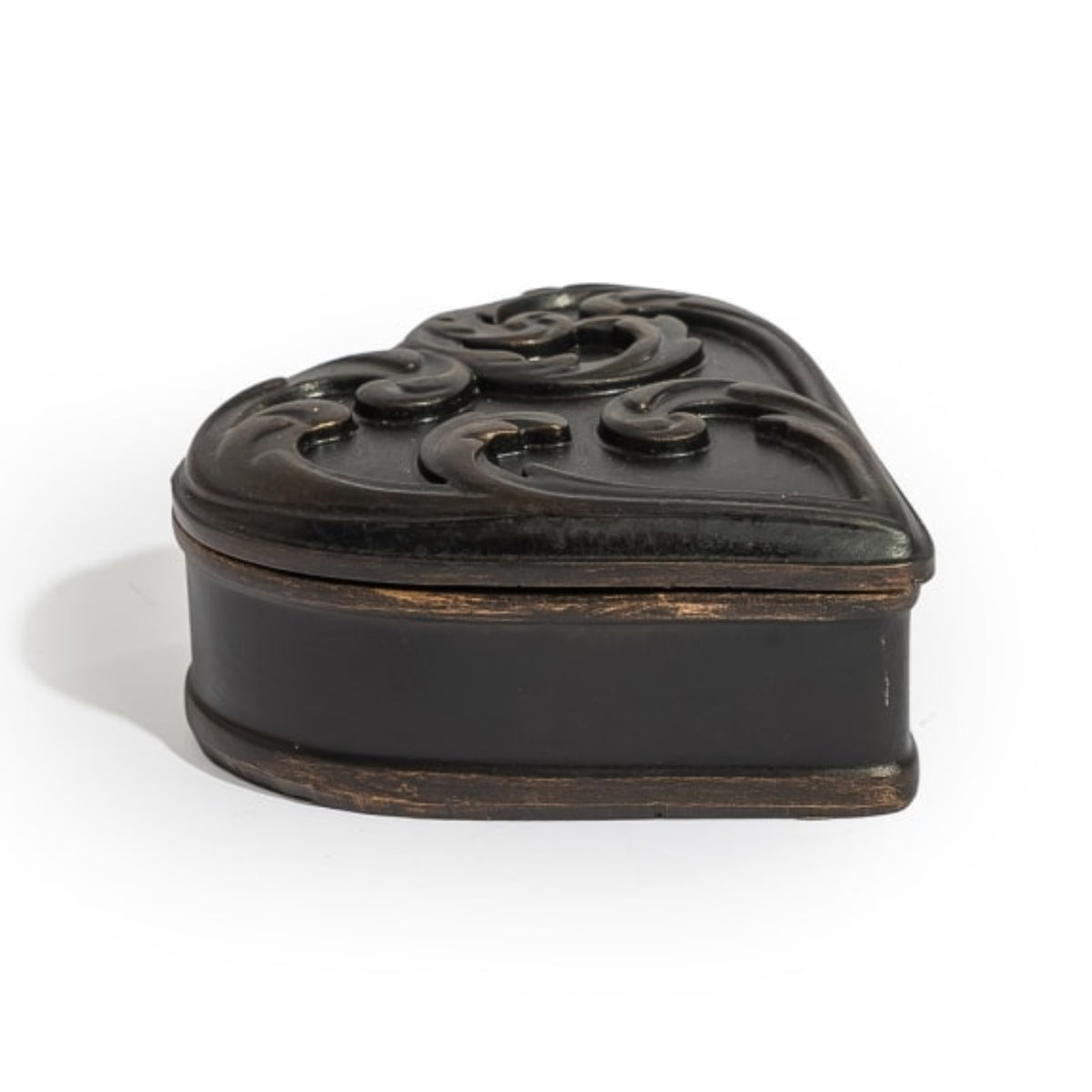 A small heart-shaped black wooden keepsake box with an ornate carved lid, photographed on a clean white background.