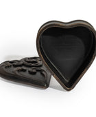 A heart-shaped dark brown wooden keepsake box with a carved scrollwork lid, shown open on a white background.