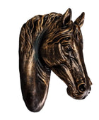 Bronze horse head sculpture on a white background