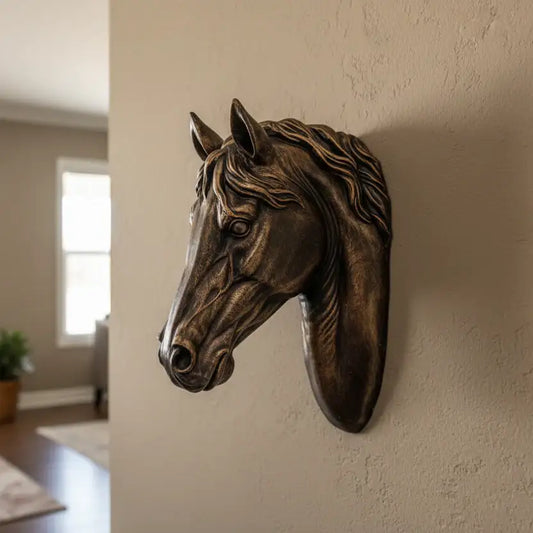 Bronze horse head sculpture on a wall