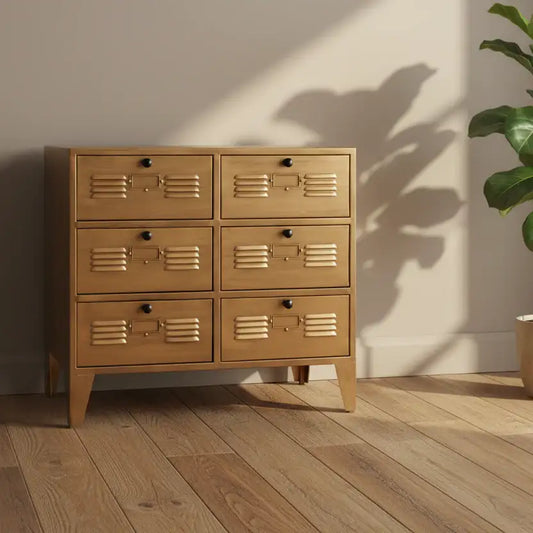 Wooden dresser with multiple drawers in a room with a plant and wooden floor.