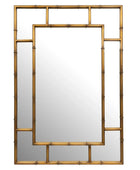 Gold-framed mirror with geometric design on a white background
