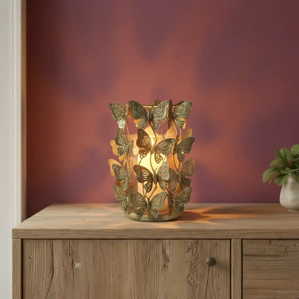 Decorative butterfly lamp on a wooden cabinet with a warm glow against a blurred background
