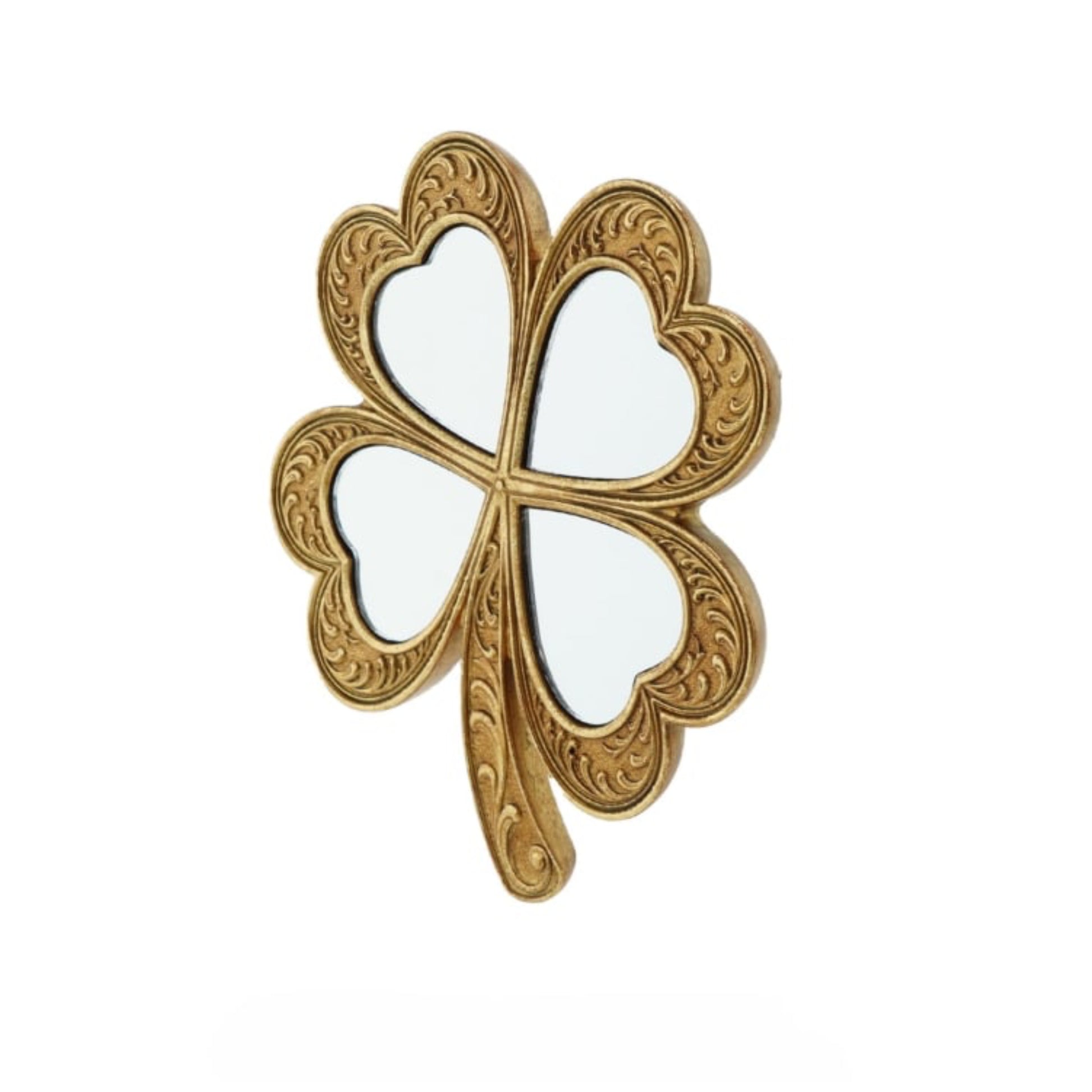 Gold four-leaf clover-shaped object on a white background