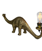Dinosaur-shaped lamp with a lit bulb on a white background