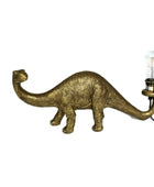 Gold dinosaur-shaped lamp with a light bulb on a white background