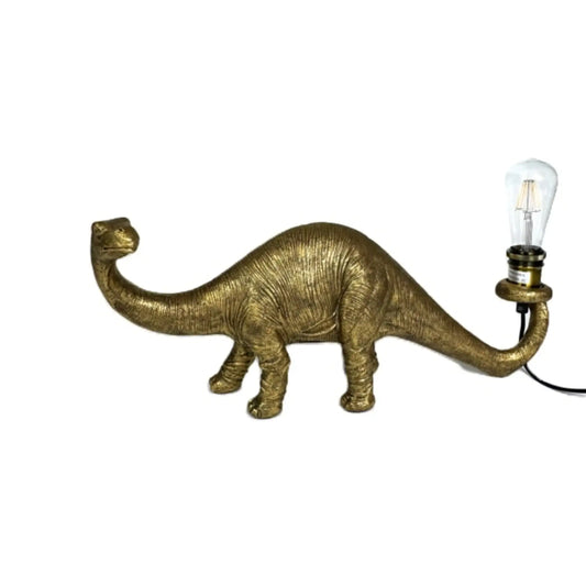 Gold dinosaur-shaped lamp with a light bulb on a white background
