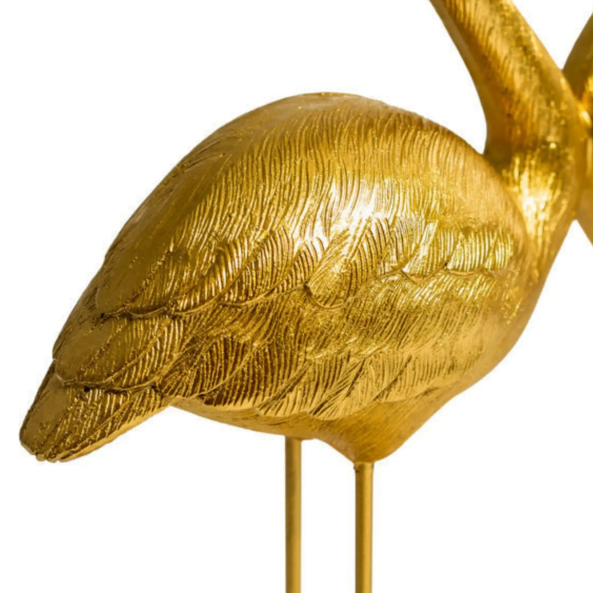 Gold bird sculpture on a white background