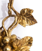 Gold leaf and berry decorative element on a white background
