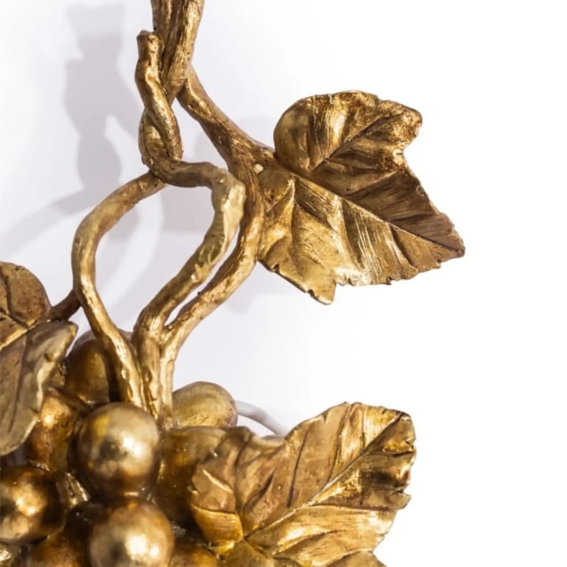 Gold leaf and berry decorative element on a white background