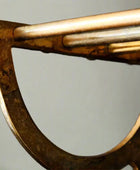 Close-up of a bronze axe head on a gray background