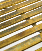 Close-up of a metal grate with a white background