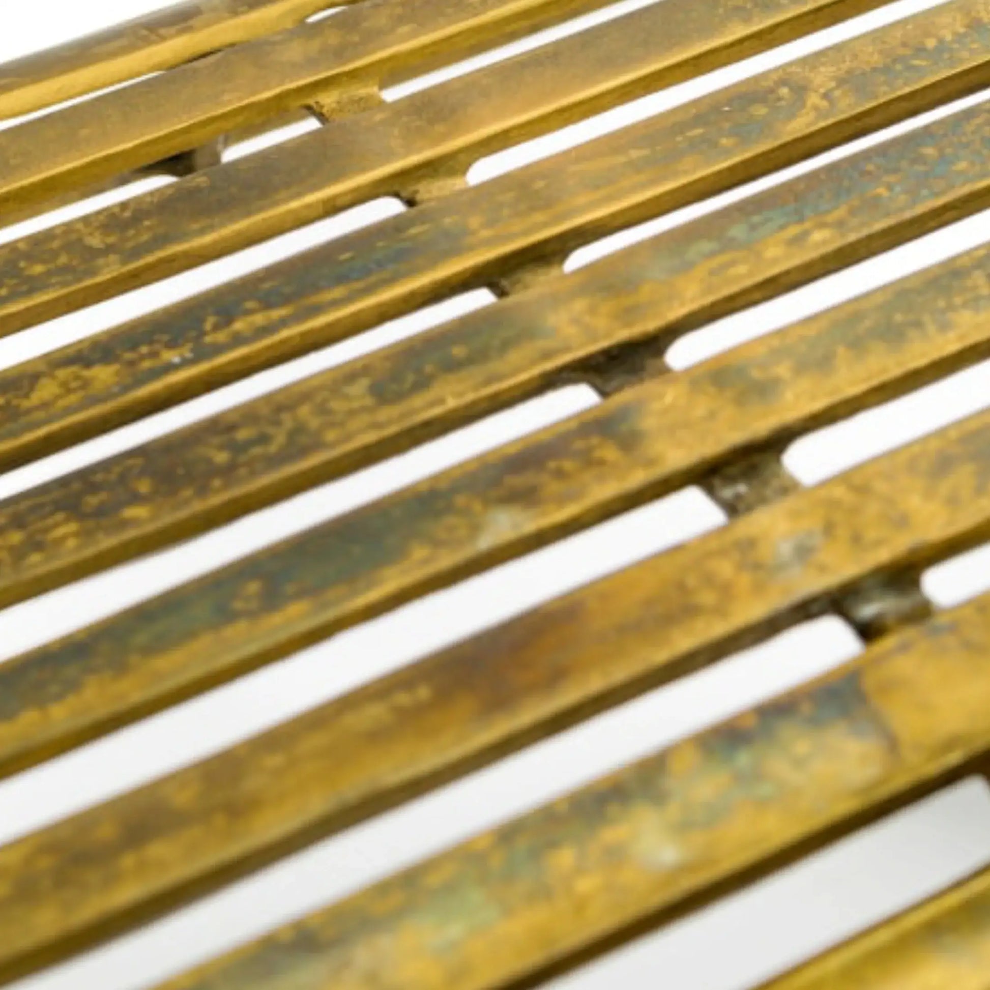 Close-up of a metal grate with a white background