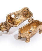 A pair of gold-toned animal-shaped candle holders shaped like a mouse and a pig, shown open on a white background.