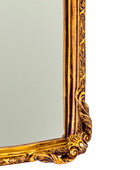 Gold ornate mirror on a white background