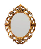 Decorative gold mirror with intricate patterns on a white background
