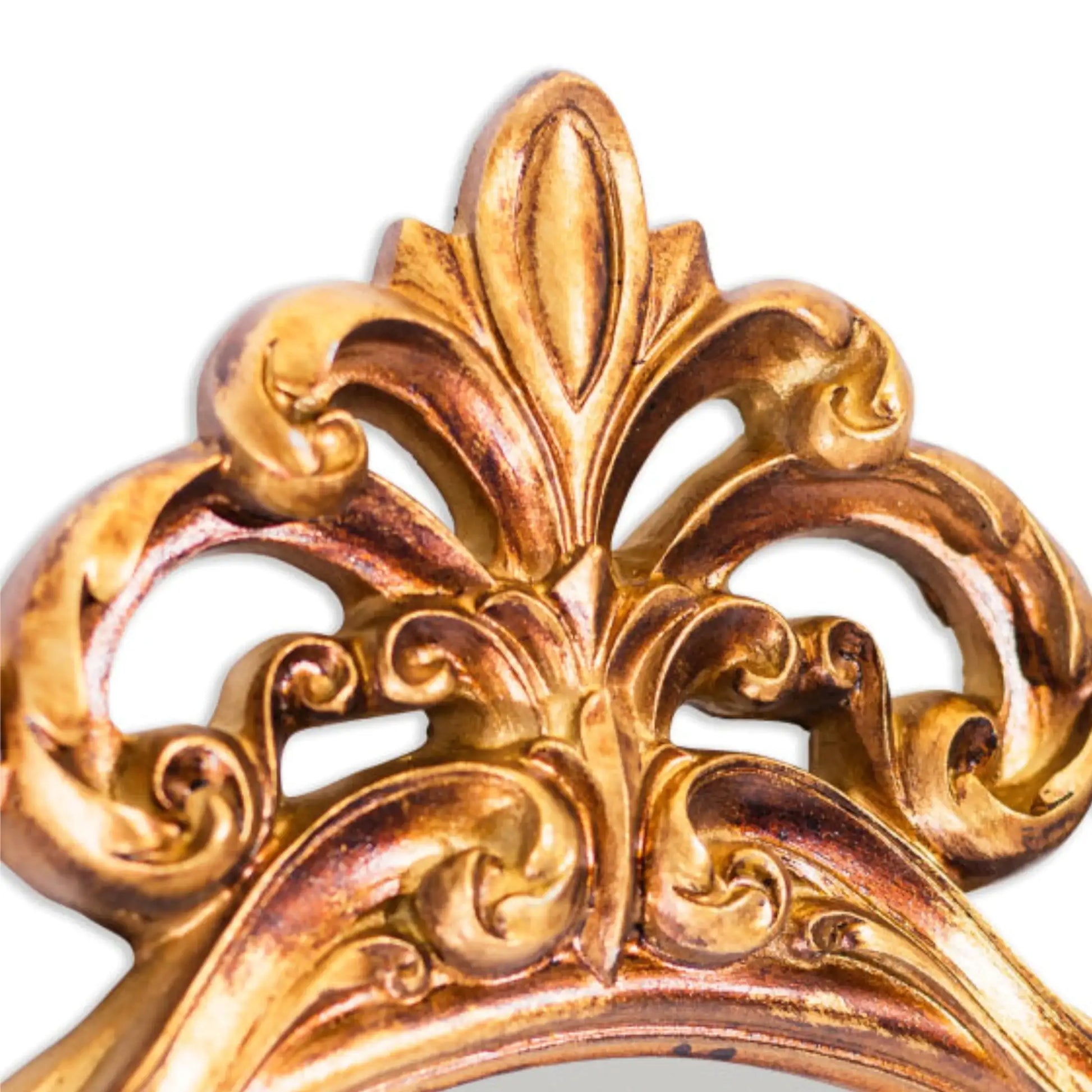 Decorative gold emblem with intricate patterns on a white background