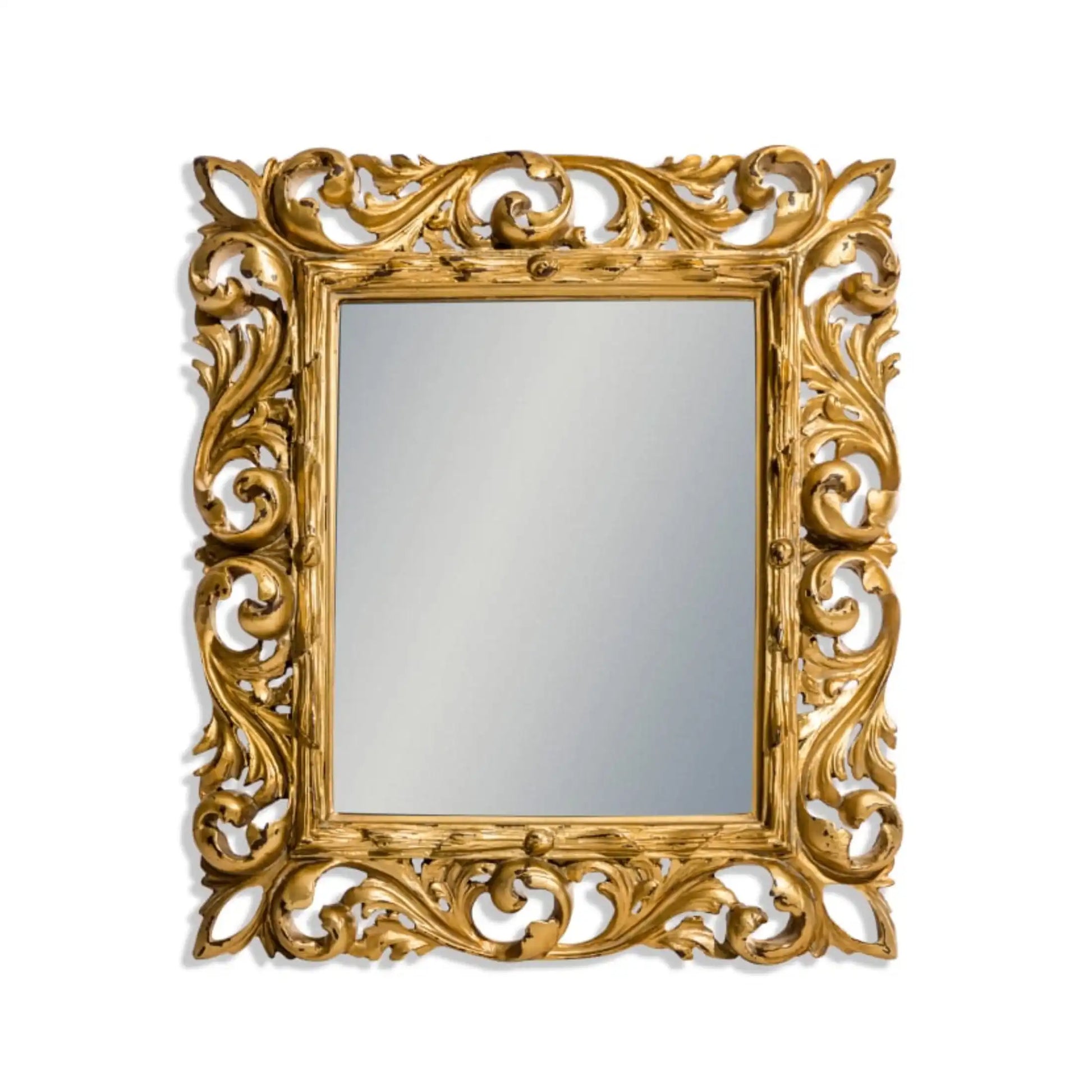 Decorative gold mirror with intricate patterns on a white background