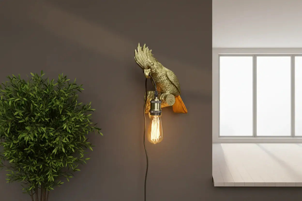 Decorative wall light fixture on a wall next to a plant and window.