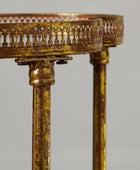 Decorative gold table with intricate design on a gray background