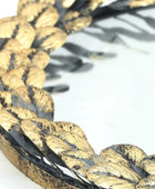 Close-up of braided gold and black cord on a white background